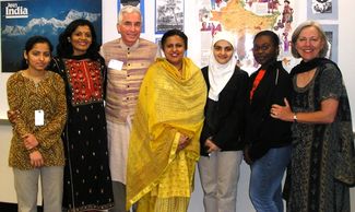 Robert Arnett and Smita Turakhia with high school students after India slide presentation.