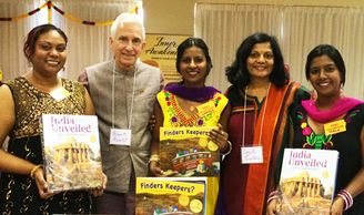 Robert Arnett and Smita Turakhia with a group in Trinidad with their India books.