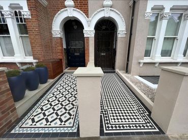Victorian style tiles in different patterns in neighbouring front gardens of two London townhouses.