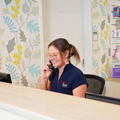 A picture of happy, smiling staff member Natalie Bullpitt at Jonathan Loughlin Dental.