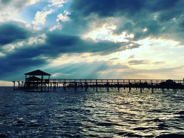 A dramatic view of piers in Lake Pontchartrain at North Shore Beach.