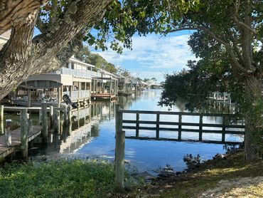 A tranquil view of Houses along the waterfront in North Shore Beach.