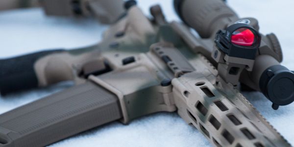 Cerakoted gun laying on snow.