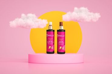 A pink image of two bottles of hair product sitting on a pedestal in front of a sun and clouds