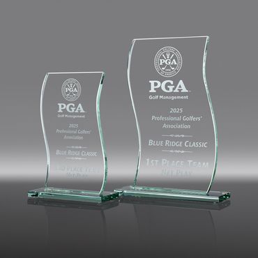 Two transparent trophies with "PGA Golf Management" text visible