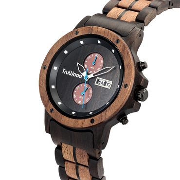 Close-up of a watch's face that is made of mostly wood and has silver hands with blue accents