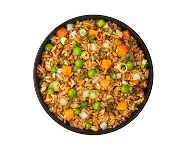 A bowl of fried rice with carrots, peas, and scallions