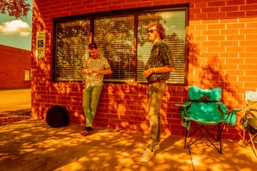 Nick and Derek taking a break outside during a recording session.