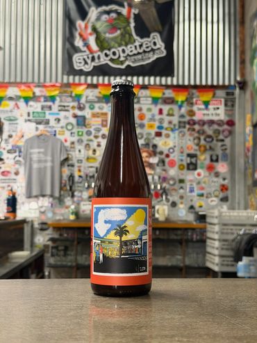 A bottle of Syncopated beer on the bar under the Syncopated banner