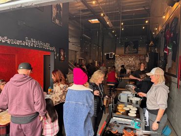 Guests lined up at the counter in the taproom