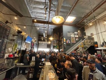 A full house of people in the Syncopated taproom