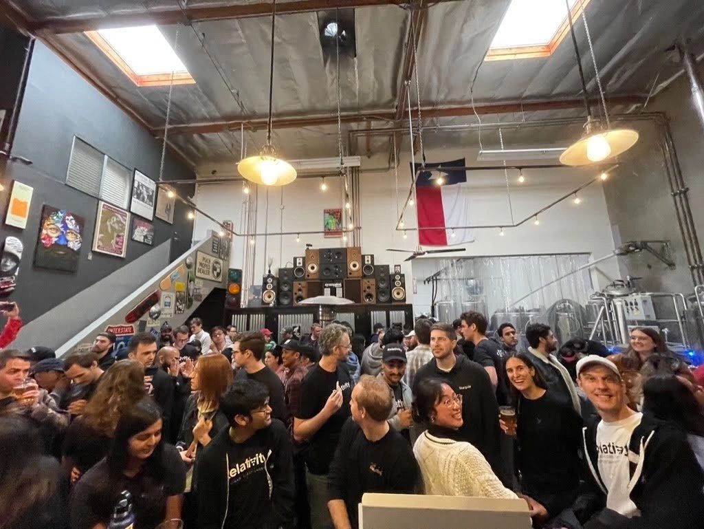 A packed crowd around the bar in the Syncopated Brewing taproom