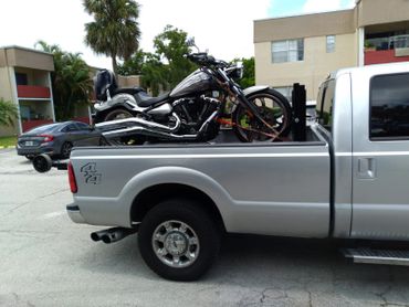 Towing a custom motorcycle in for service.