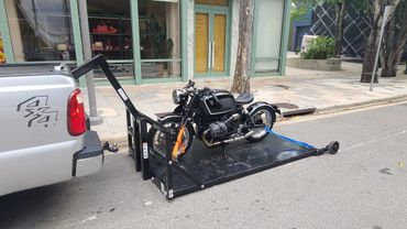 Towing a BMW Motorcycle to the Gucci Showroom