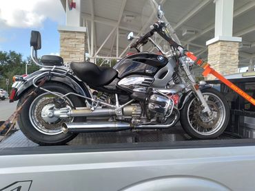 Towing a BMW motorcycle in for service.