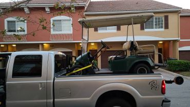 Towing a golf cart to Wellington, Florida.