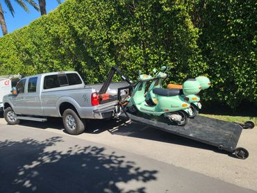 Towing Vespas for service
