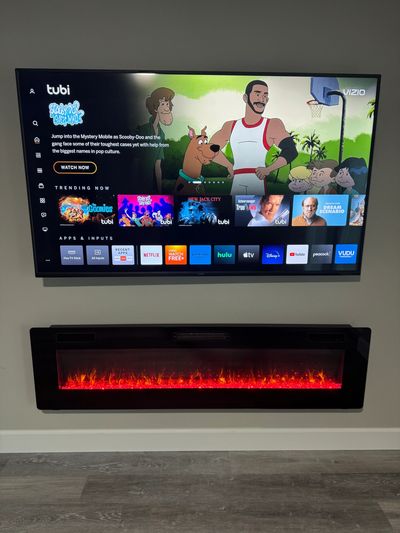 TV mounted over a electric fireplace