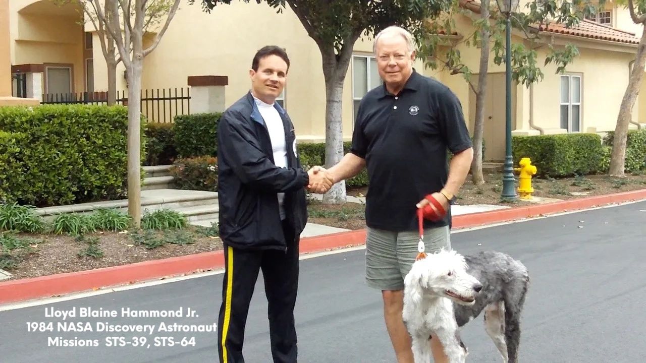NASA astronaut Blaine Hammond Jr. Working with his recue dog.