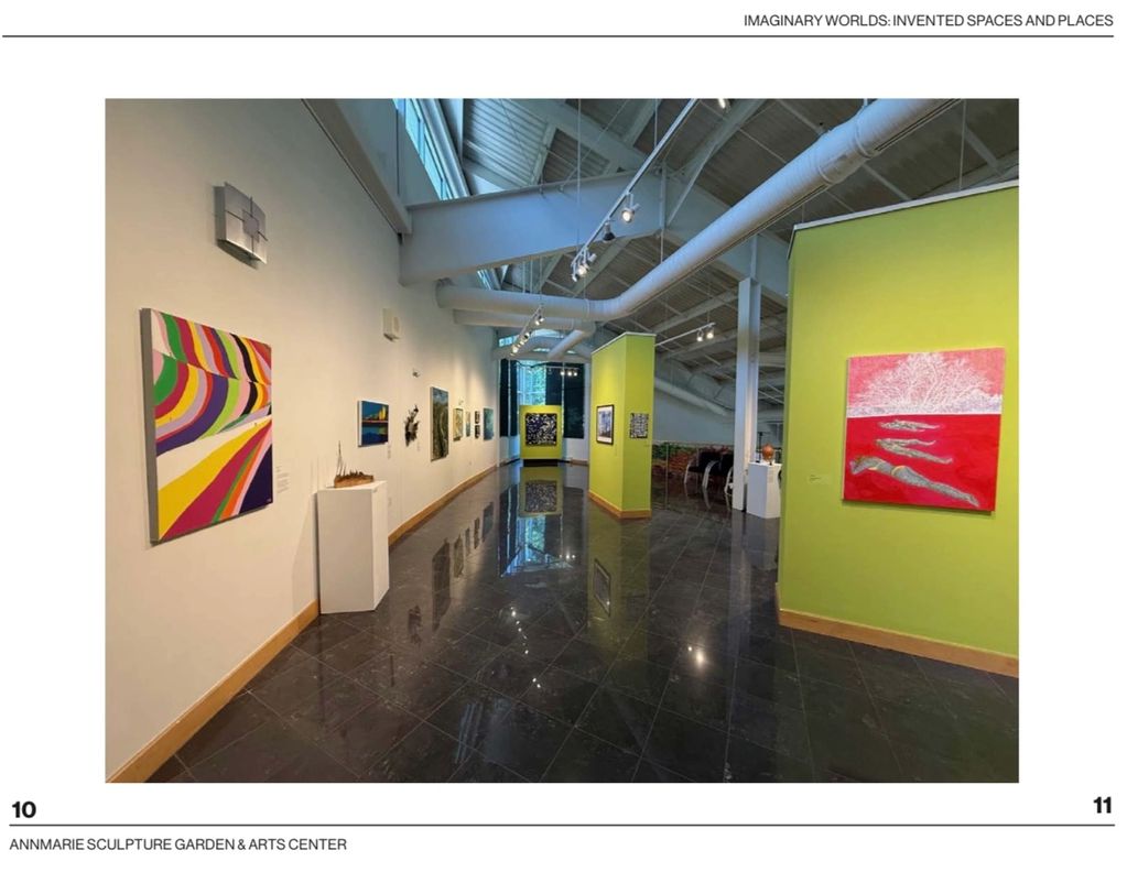 Interior view of Annmarie Sculpture Garden & Arts Center with colorful paintings and sculptures.