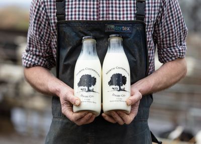 Farmer holding Milk Bottles, north cotswolds dairy co, glass bottles, milk vending machine, farm