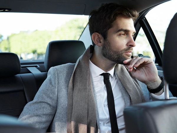 male passenger in a car