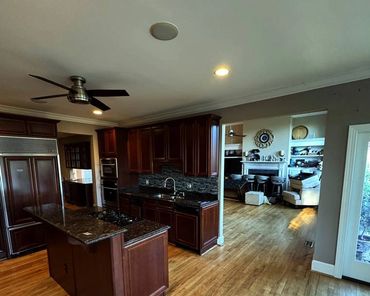 Load-bearing wall removal Mount Pleasant SC: kitchen and living before, O'Laughlin Construction