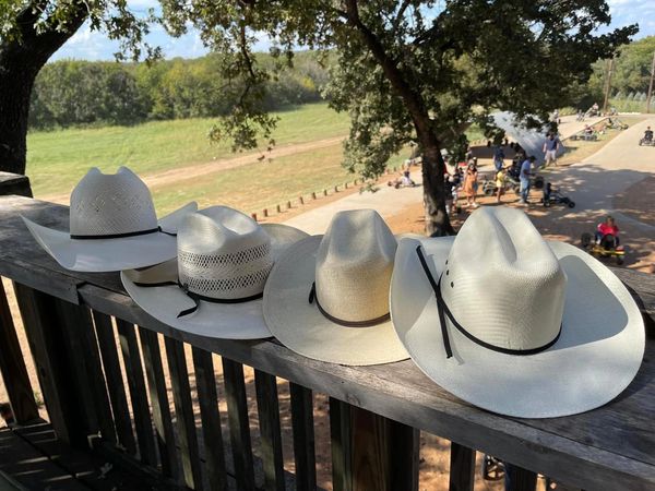 Four cowboy hats representing the founders of the Roll Call Foundation