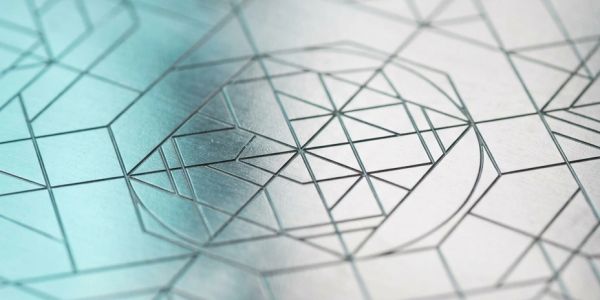 Close-up of geometric line patterns on paper.