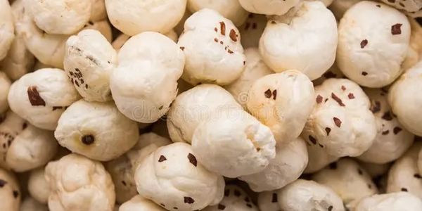 Close-up of popped popcorn kernels with some brown spots.