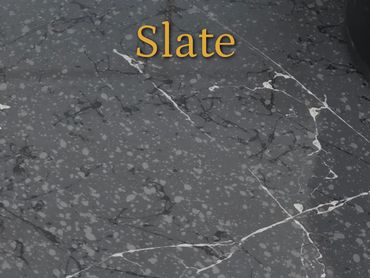 Slate texture with white veins and spots.