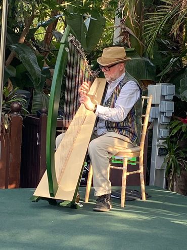 Photo of Martin playing in the Palm House, Sefton Park, Liverpool.