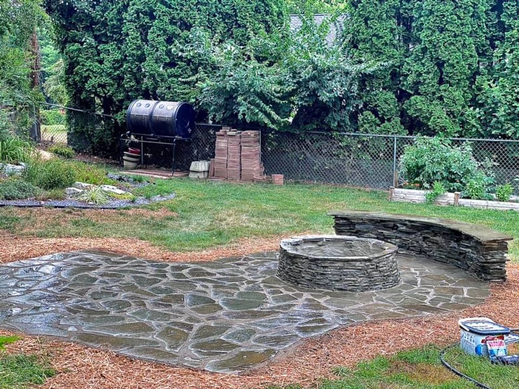 Flagstone patio with sitting wall .
Keeping it an all natural look