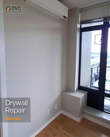Finished wall beneath a wall-mounted unit after drywall repair