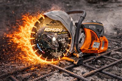 A power saw cutting metal with sparks flying.