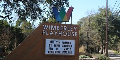 Wimberley Playhouse sign announcing a play titled The Tin Woman.