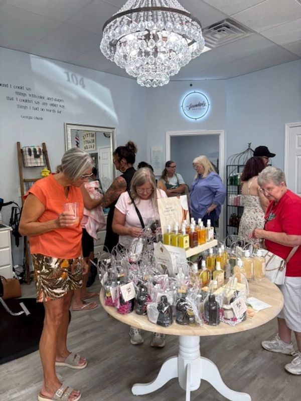 Women browsing skincare products at a boutique.