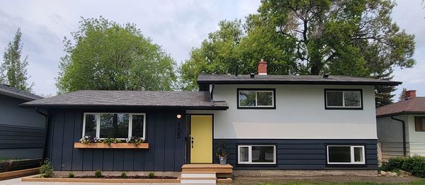 Full House renovation in Fairview. New Windows, new siding, flower beds, 
 New concrete.
