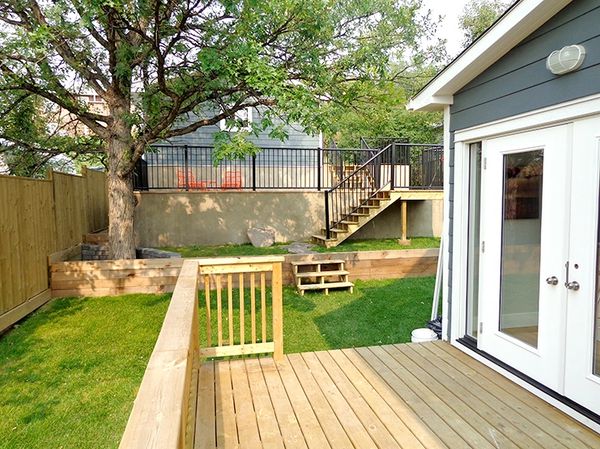 Backyard Landscaping renovation. Retaining walls, Hardie Siding, new deck, natural elements, outdoorp