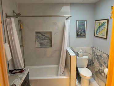 Finished modern bathroom with shower and toilet