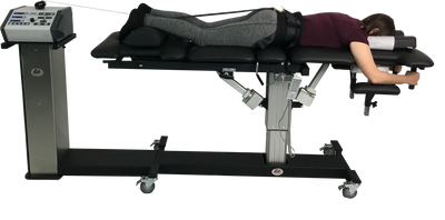 Spinal decompression uses computer technology to control variations in the unloading of the spine