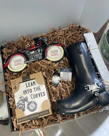 Biker-themed gift box with boots, motorcycle coaster, and gnome - Custom gift baskets available upon request.