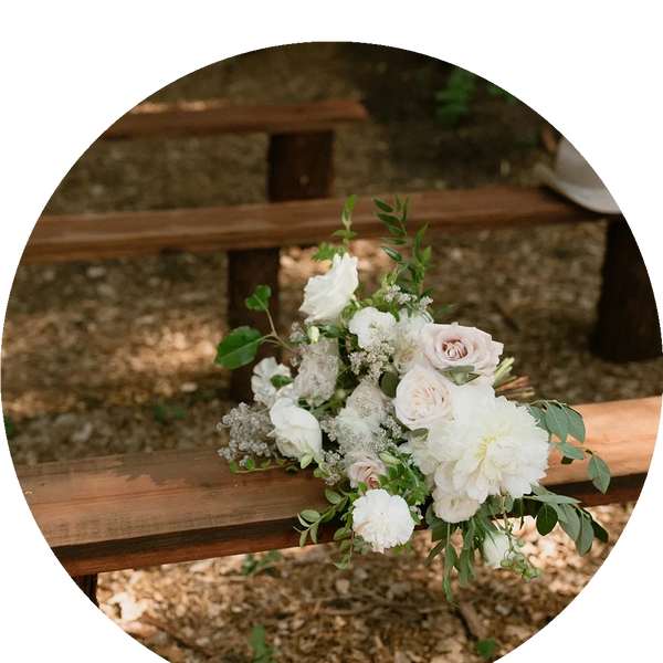 bridal bouquet on redwood bench