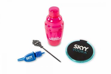 Pink cocktail shaker and bar tools