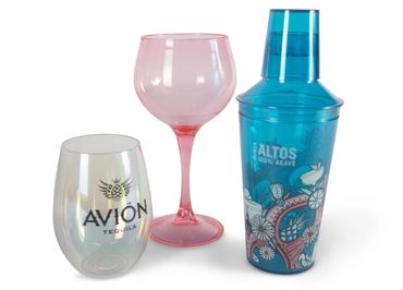 Pink wine glass and blue cocktail shaker