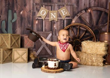 Baby boy wearing western attire for his cake smash photography session in Austin, Texas.