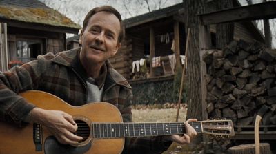 Ed Norton playing guitar on a Stillwater property