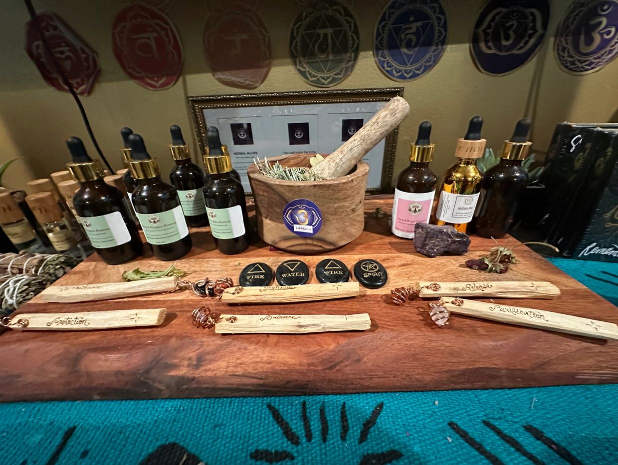 Spiritual healing setup with essential oils and stones.