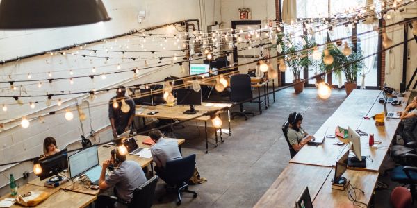 Modern co-working space with string lights.