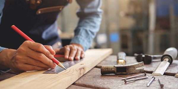 Carpenter working on wooden table